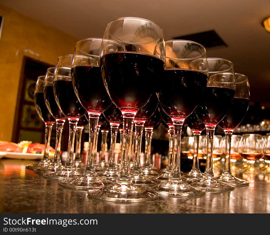 Glasses with wine on an ablaze background