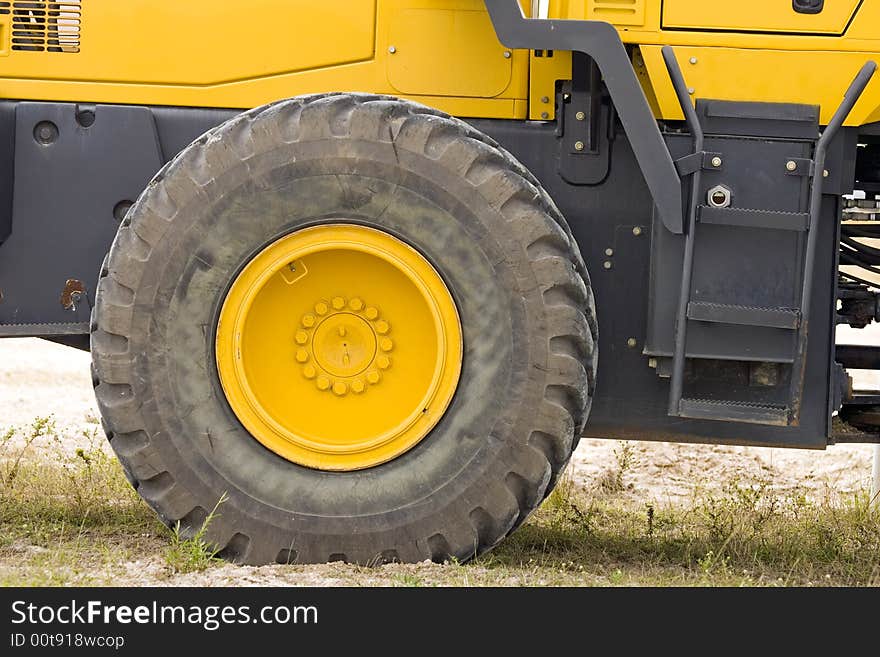 The rolling end of a front-end loader: Tire and wheel