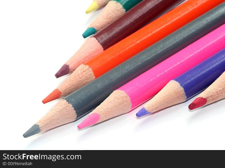 Colored pencils on white background. Colored pencils on white background.