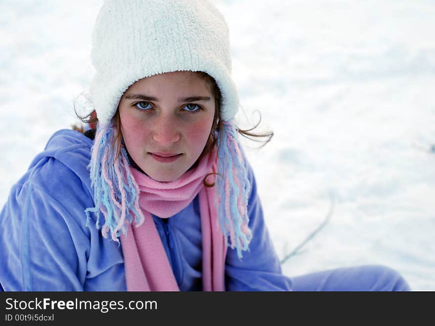 Young girl is playing in the snow. Young girl is playing in the snow