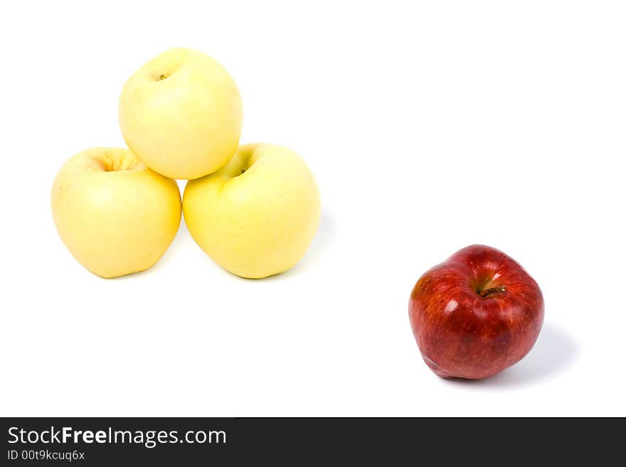 Three yellow and one red apples isolated on white background. Three yellow and one red apples isolated on white background