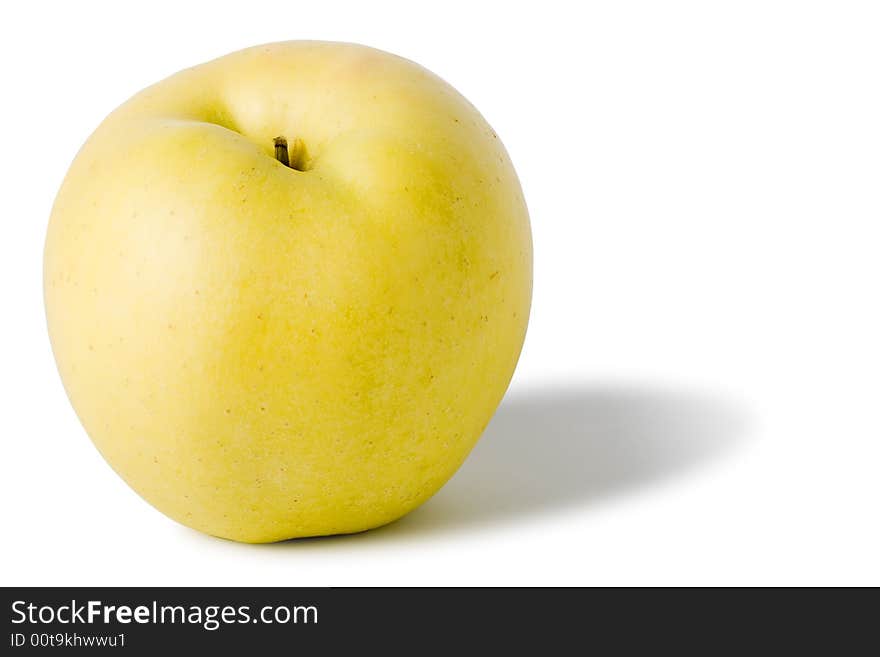 One yellow apple with shadow isolated on white background