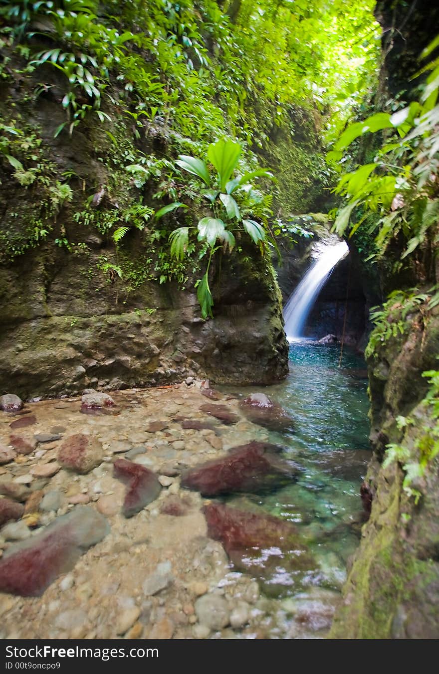 Spectacular waterfall and pool on lush tropical island. Spectacular waterfall and pool on lush tropical island