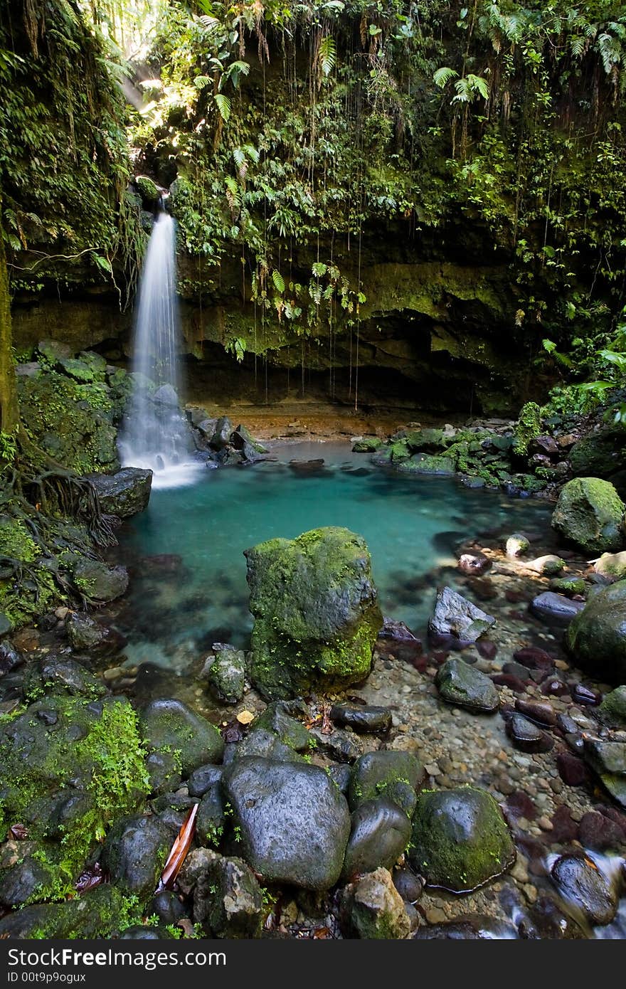 Spectacular waterfall and pool on lush tropical island. Spectacular waterfall and pool on lush tropical island