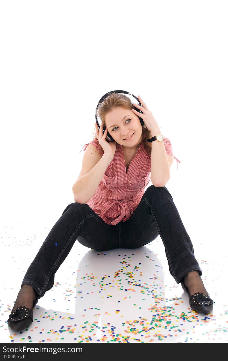 The young girl with a headphones isolated on a white background