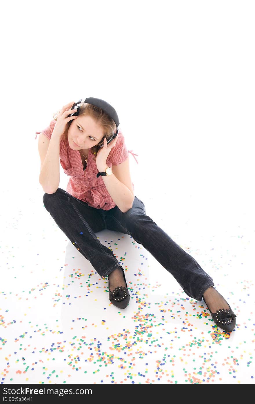 The young girl with a headphones isolated on a white background