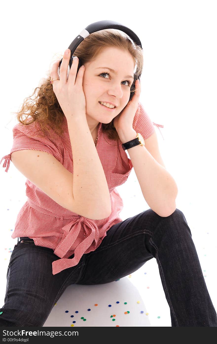 The young girl with a headphones isolated on a white background