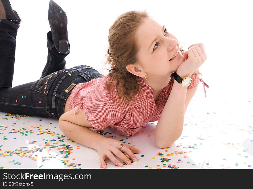 The young beautiful girl with the confetti isolated on a white background. The young beautiful girl with the confetti isolated on a white background