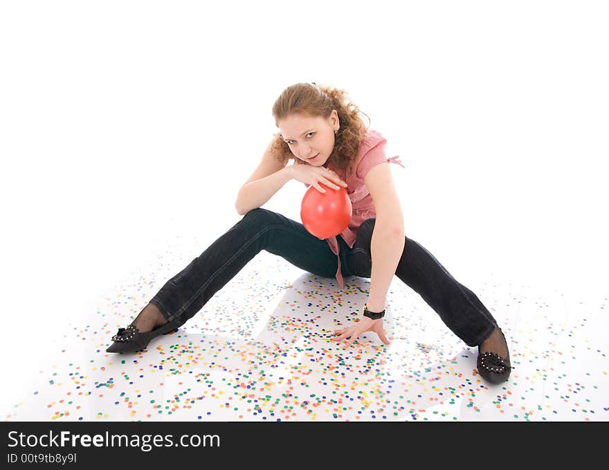 The young beautiful girl with the confetti isolated on a white background. The young beautiful girl with the confetti isolated on a white background