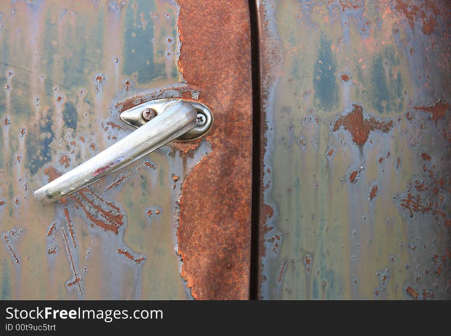 Abstract detail of the door handle on an old rusty abandoned truck. Abstract detail of the door handle on an old rusty abandoned truck