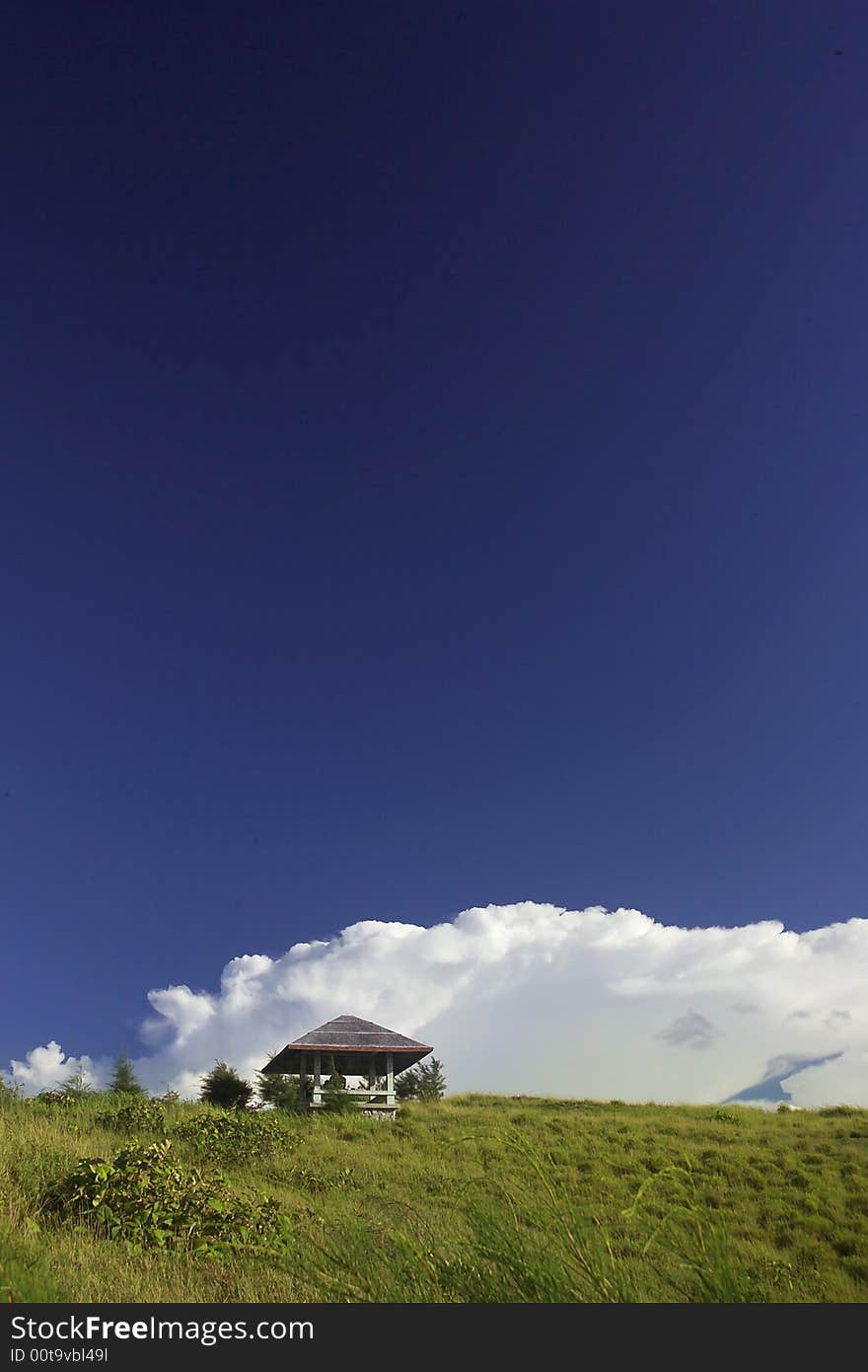 Kiosk on a field with bluy sky