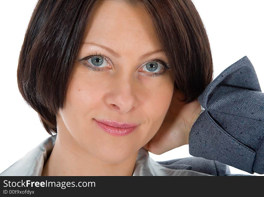 Portrait of the brunette with blue eye on  white background