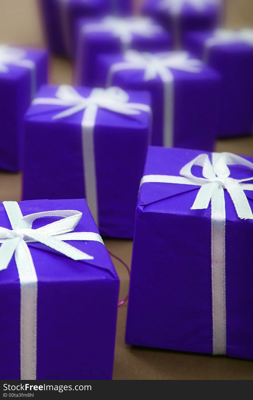 Gifts in blue paper isolated on white background