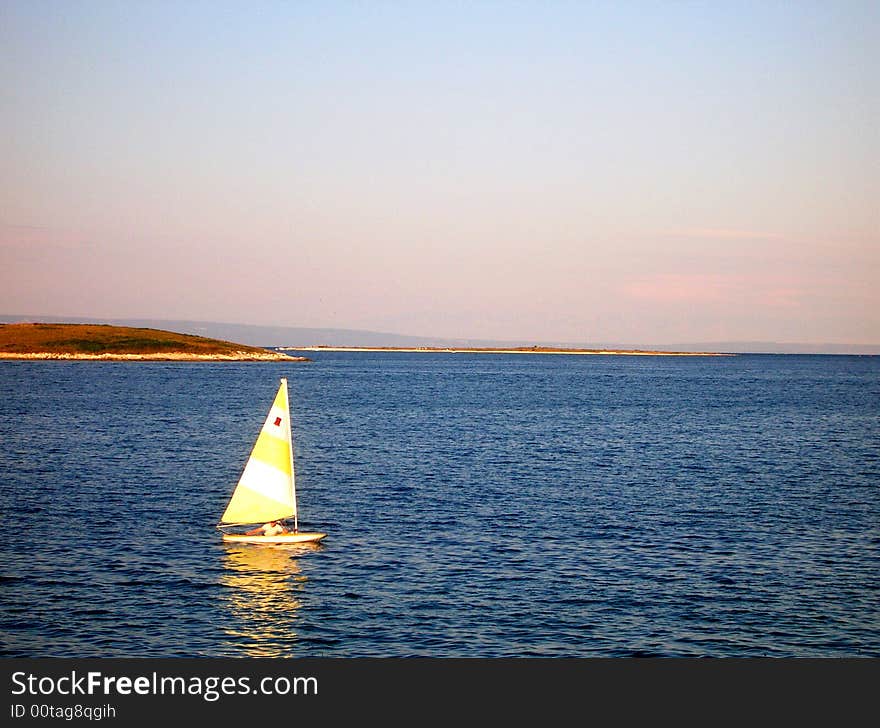 Rowing sailing boat in Croatia sea - in the evening light. Rowing sailing boat in Croatia sea - in the evening light