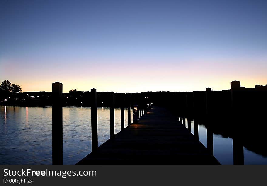 Wooden boat docking platforms in the evening sun light