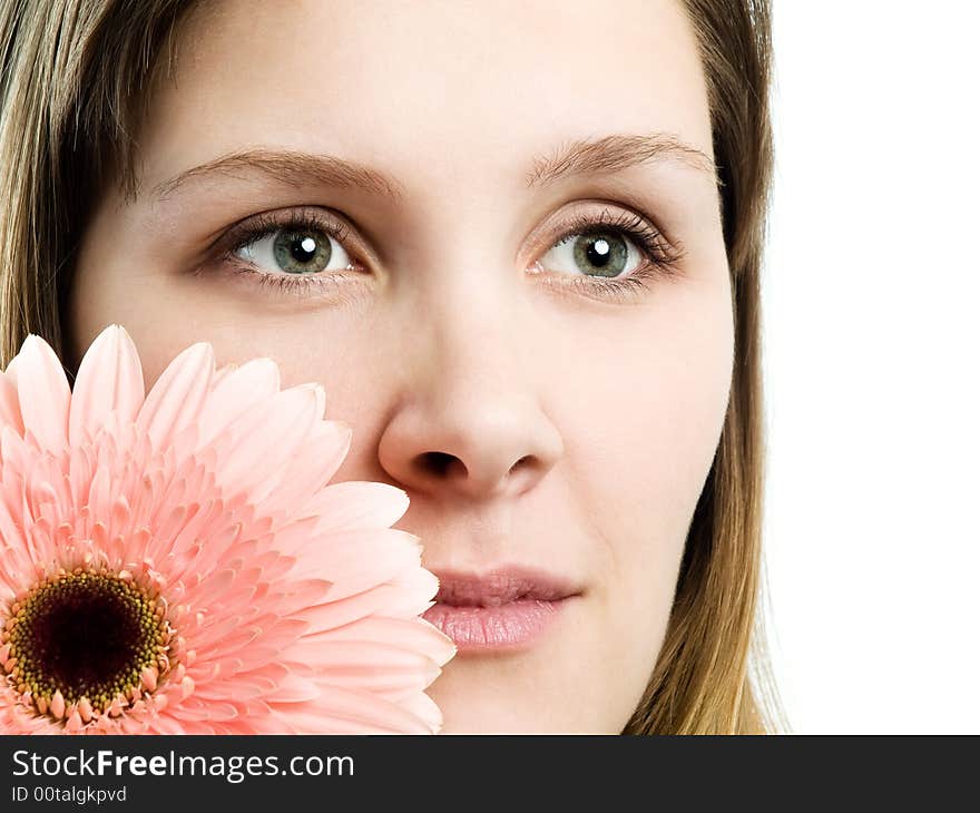 Close up portrait of a girl with pink flower. Close up portrait of a girl with pink flower