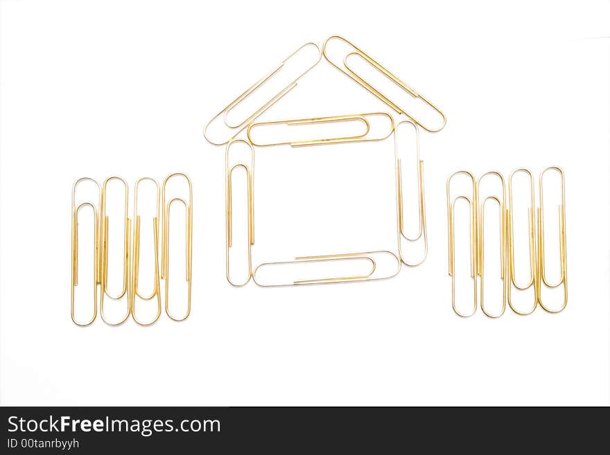 House from paper clips on the white isolated background