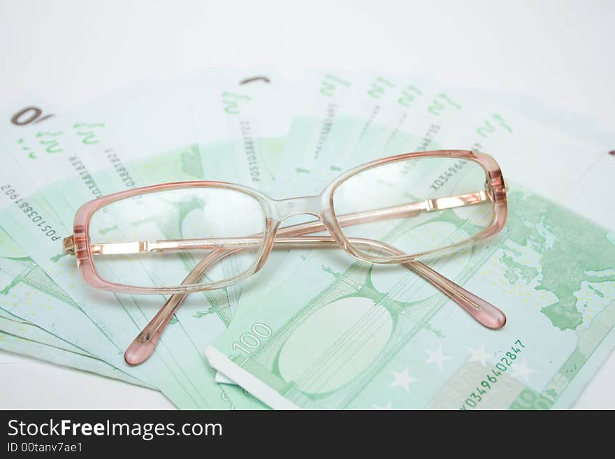 Modern eyeglasses over money euro. Modern eyeglasses over money euro