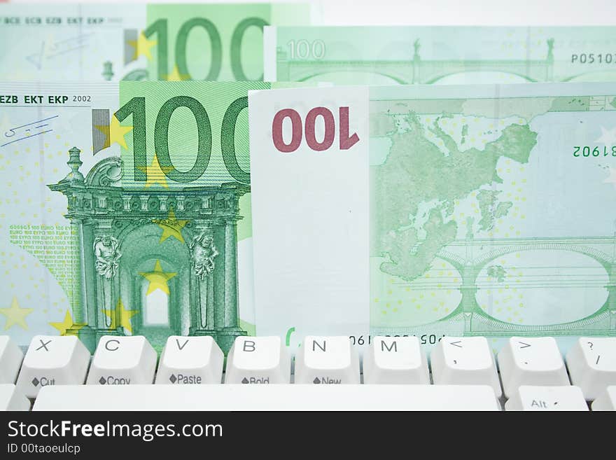 Some 100 euros banknotes on the keyboard