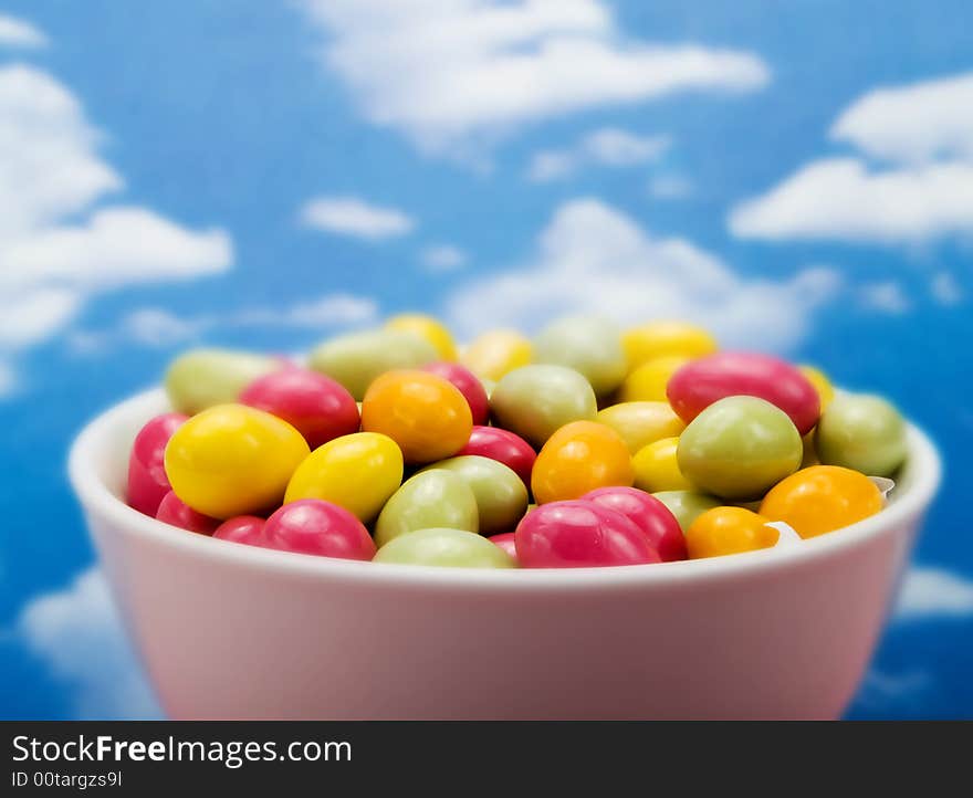 Colorful candies over a blue sky