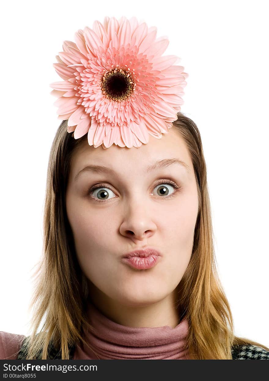 Grimacing girl with flower over head