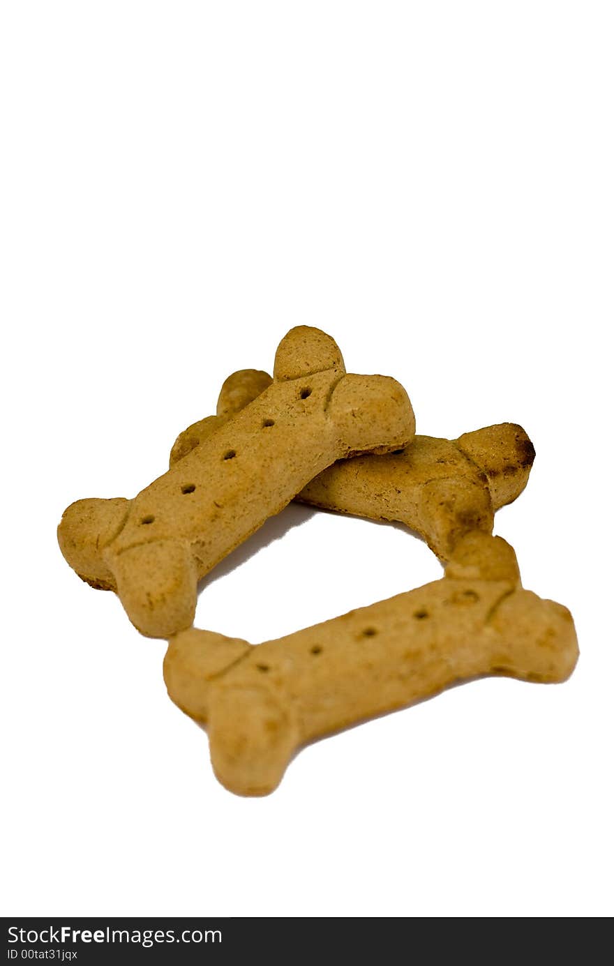 A pile of three large dog treats.