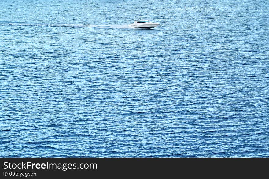 Small and lonely boat on the big sea