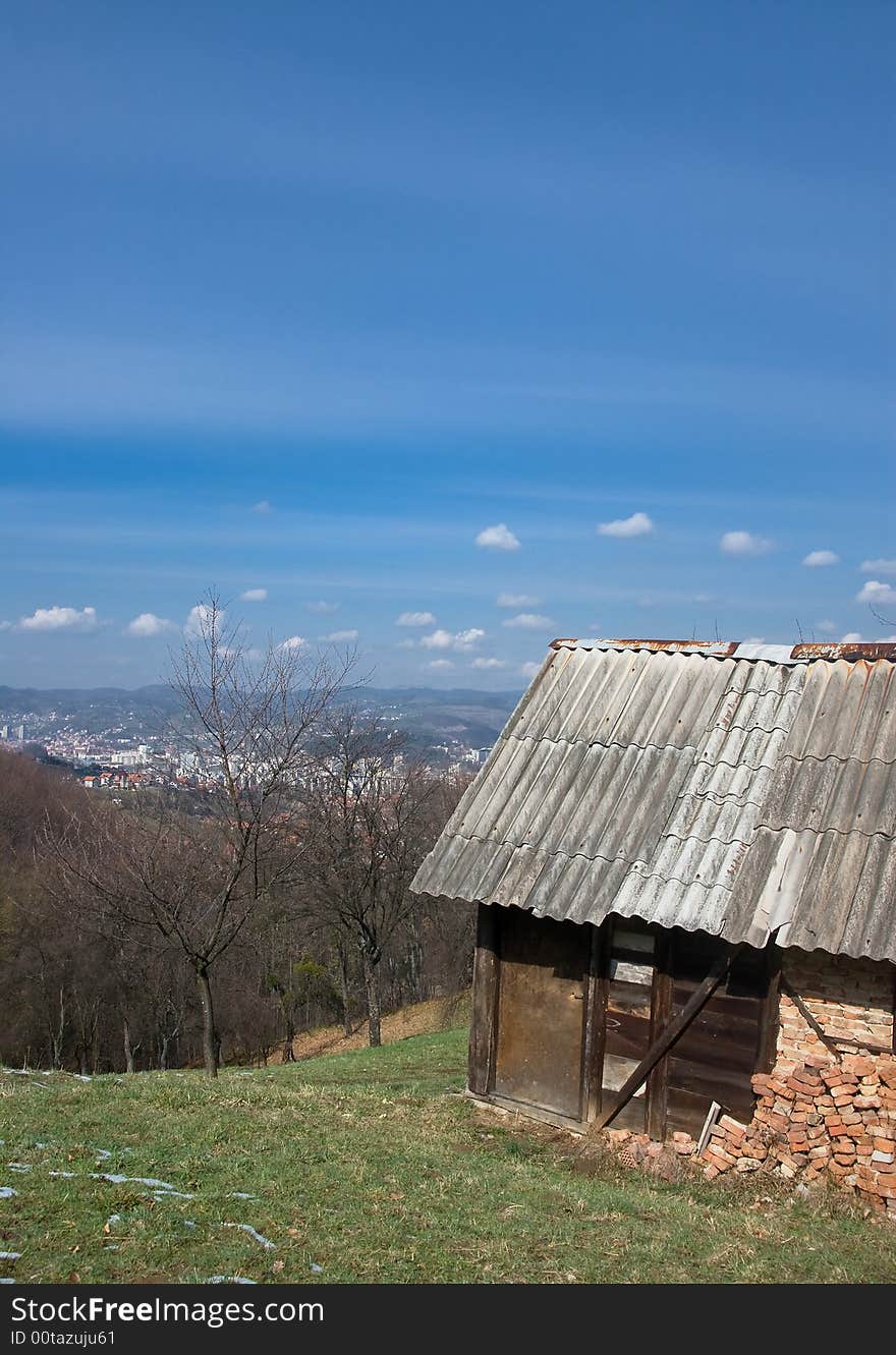 Old house on the hill with the view at the city