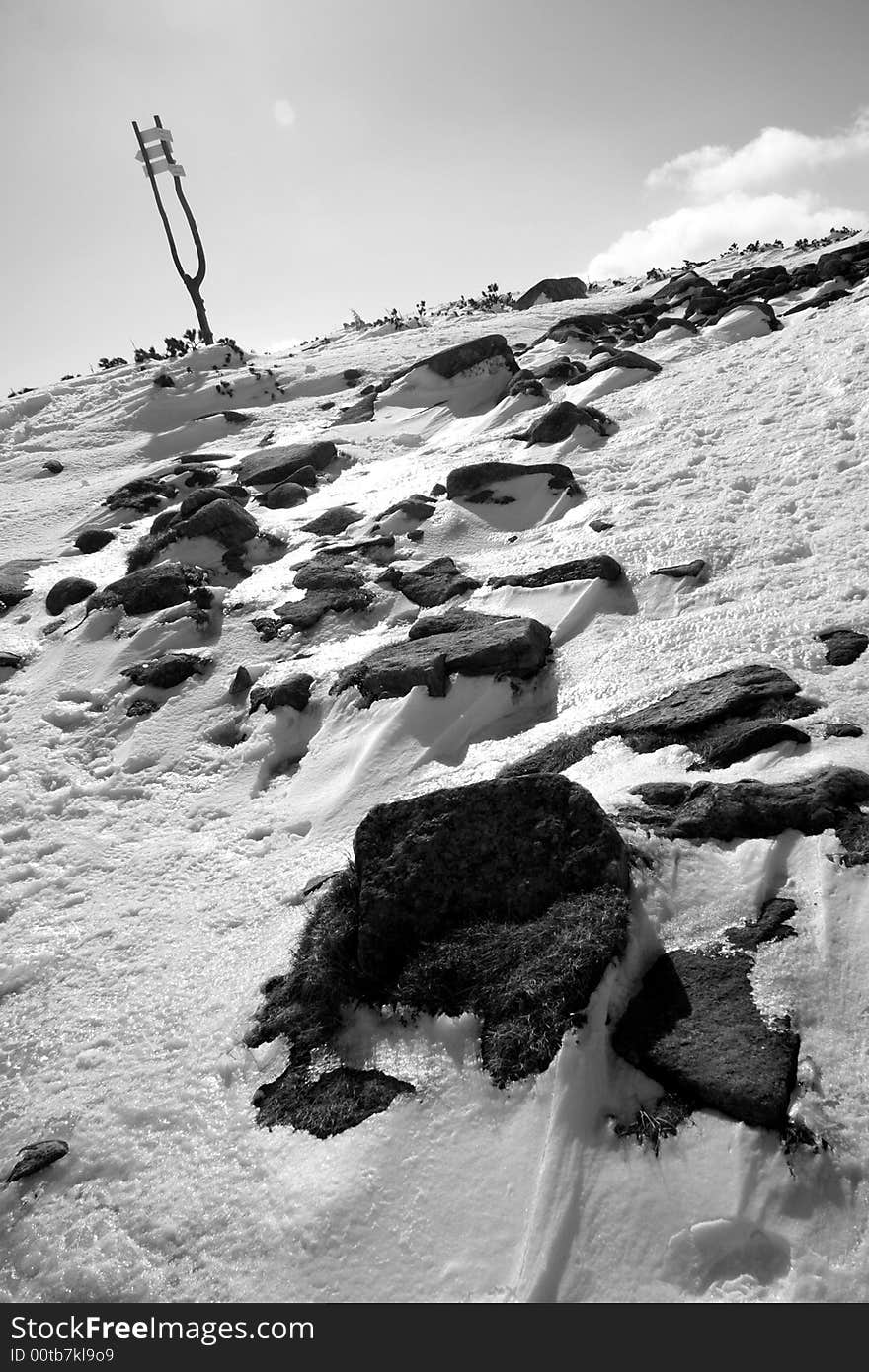 Winter monochrome landscape with stones and guidepost in Krkonose (the highest mountains in Czech republic). Winter monochrome landscape with stones and guidepost in Krkonose (the highest mountains in Czech republic)