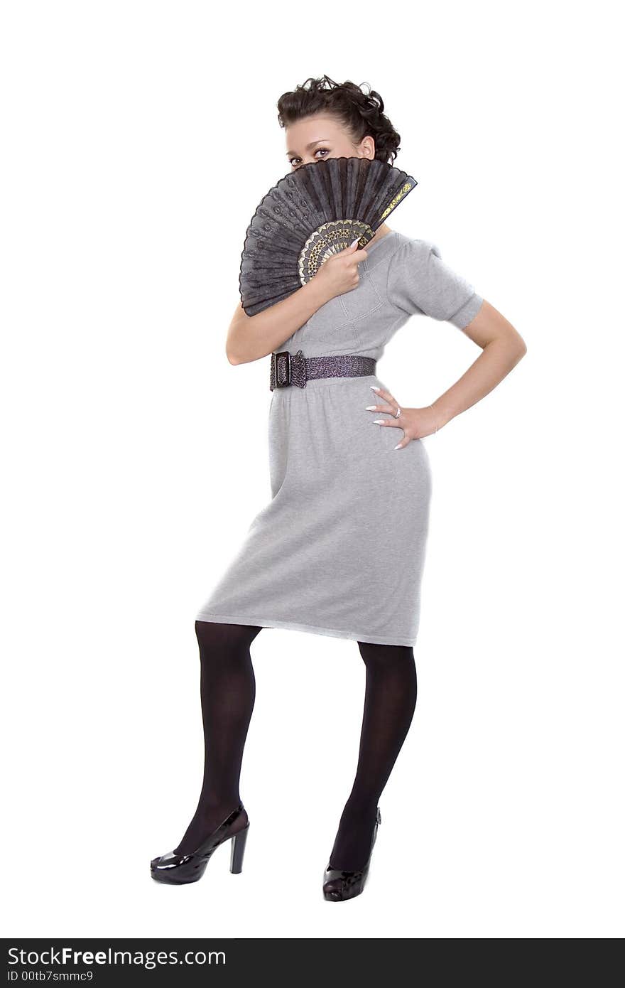 Cute lady in grey dress with a black fan over white. Cute lady in grey dress with a black fan over white