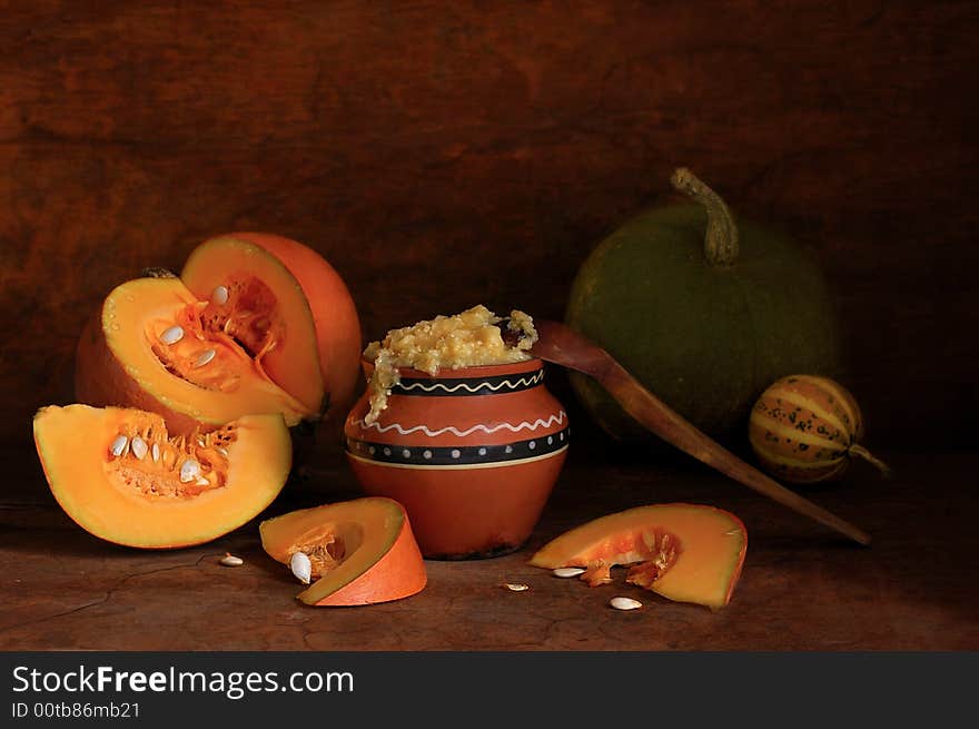 Pumpkin porridge with a wooden spoon