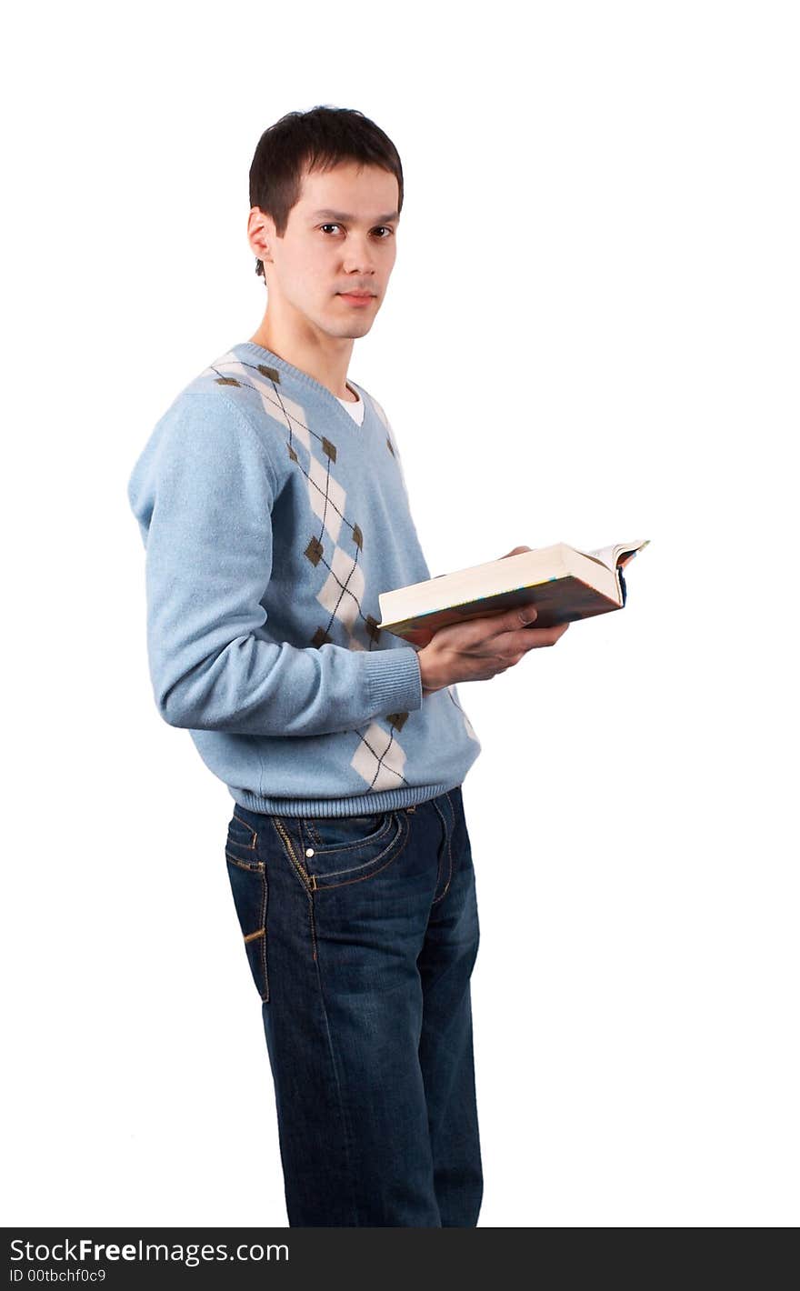 Young man with book isolated on white