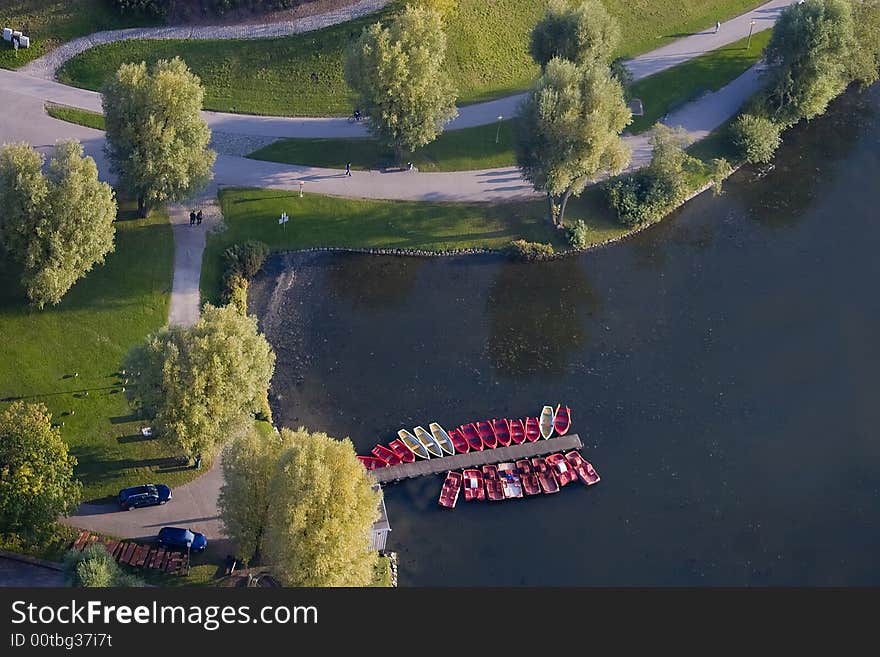 Boats at a mooring on lake. Munich, Germany. Olympic park.