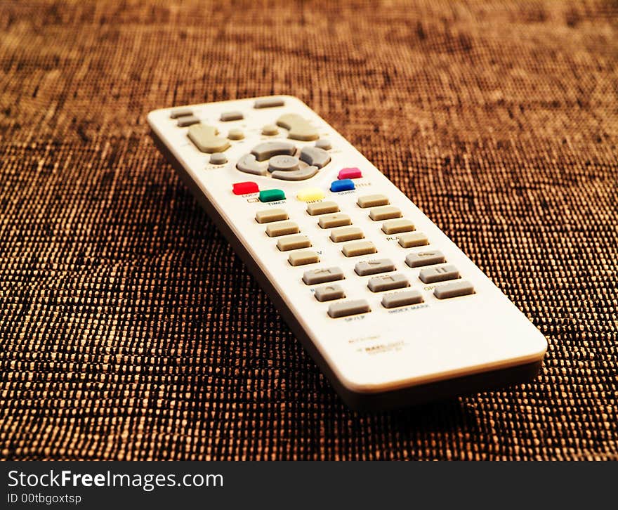 Remote tv control with shallow depth of field and unusual background