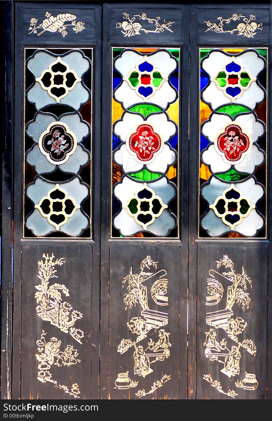 Wood screen with colorful glass