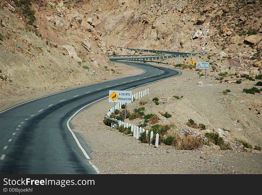 Lonely road through rough mountain scenery in Jujuy, northwestern region of Argentina. Lonely road through rough mountain scenery in Jujuy, northwestern region of Argentina