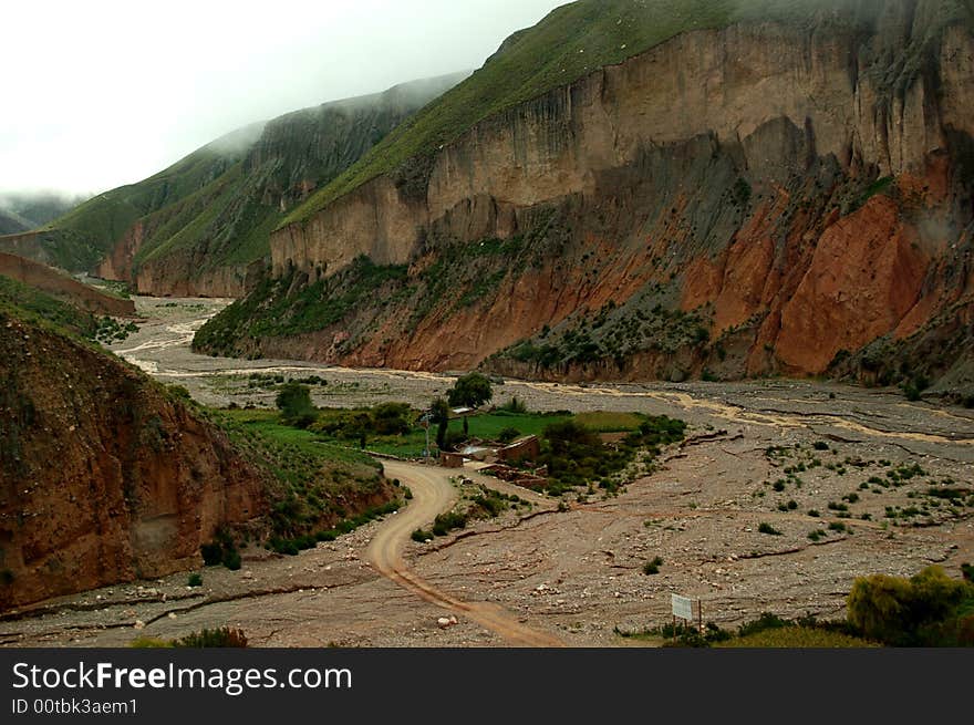 Riverbed  between rough mountain scenery in Salta, northwestern region of Argentina,. Riverbed  between rough mountain scenery in Salta, northwestern region of Argentina,