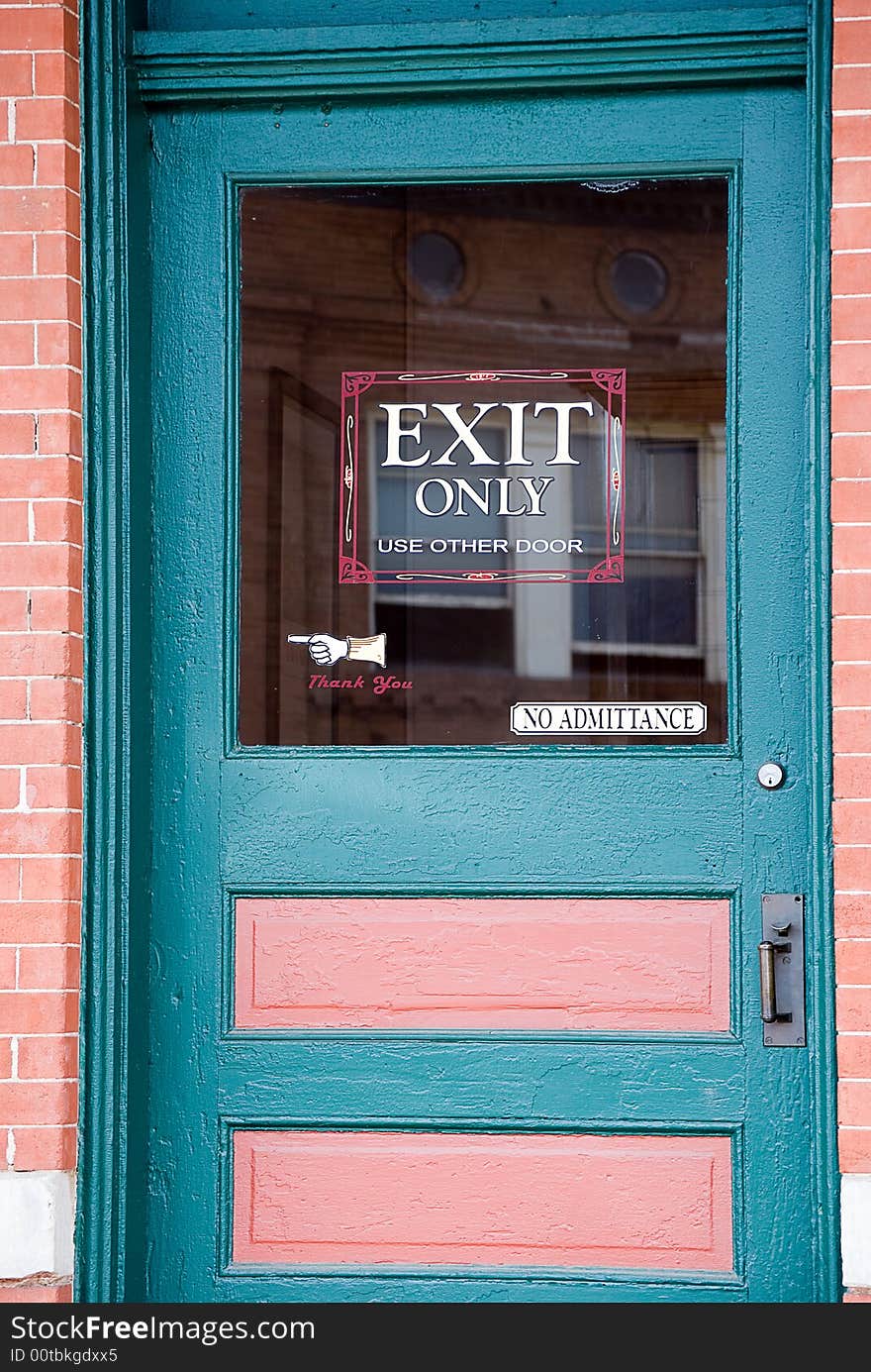 Blue and pink door with exit only sign. Blue and pink door with exit only sign