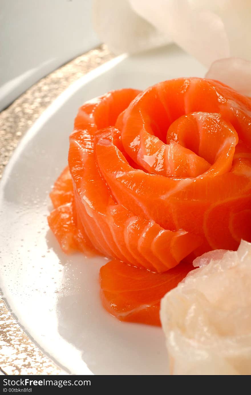 Delicious raw salmon sashimi in a flower shape. Delicious raw salmon sashimi in a flower shape