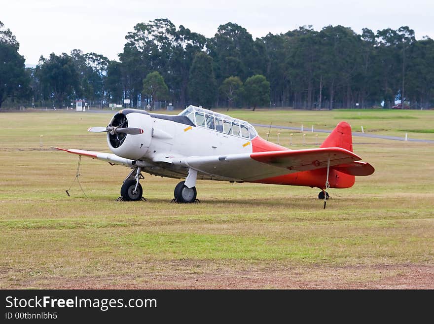 A North American Harvard on an airfield