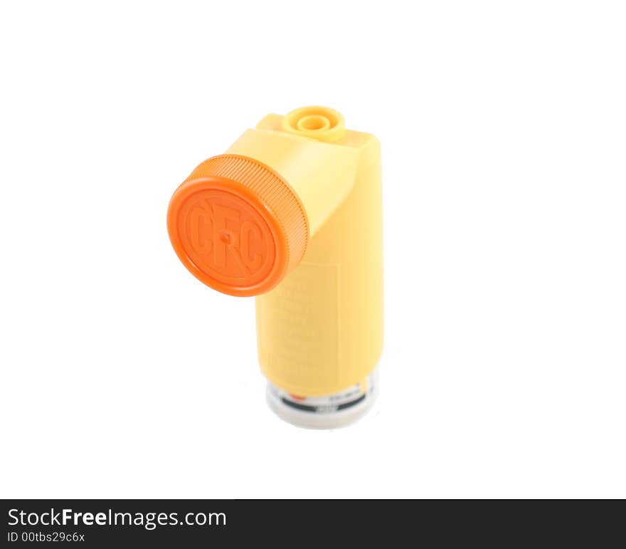 Yellow asthma inhaler with cap