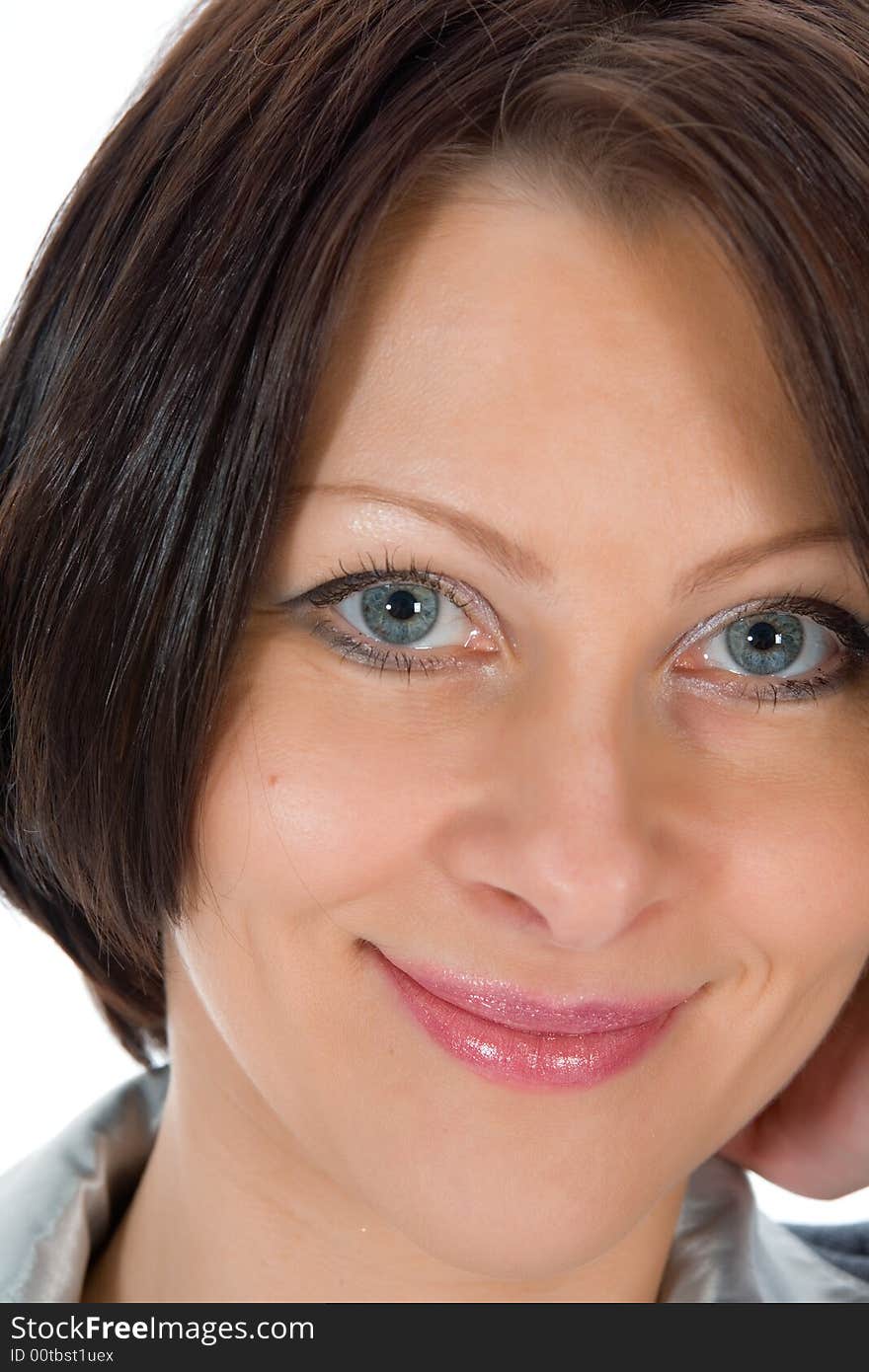 Portrait of the brunette with blue eye on  white background