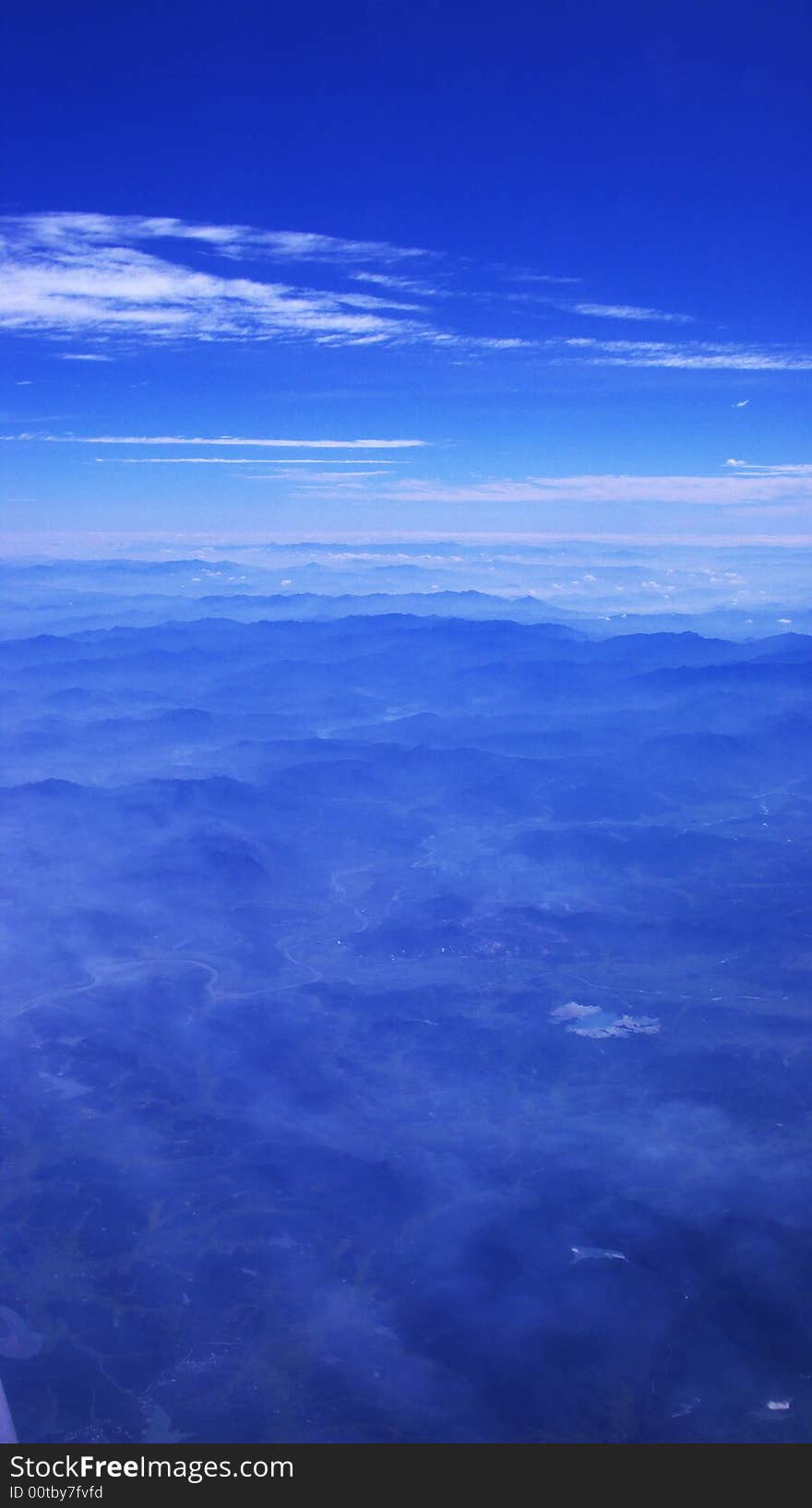 Mountain,under the sky,blue,plane,flying