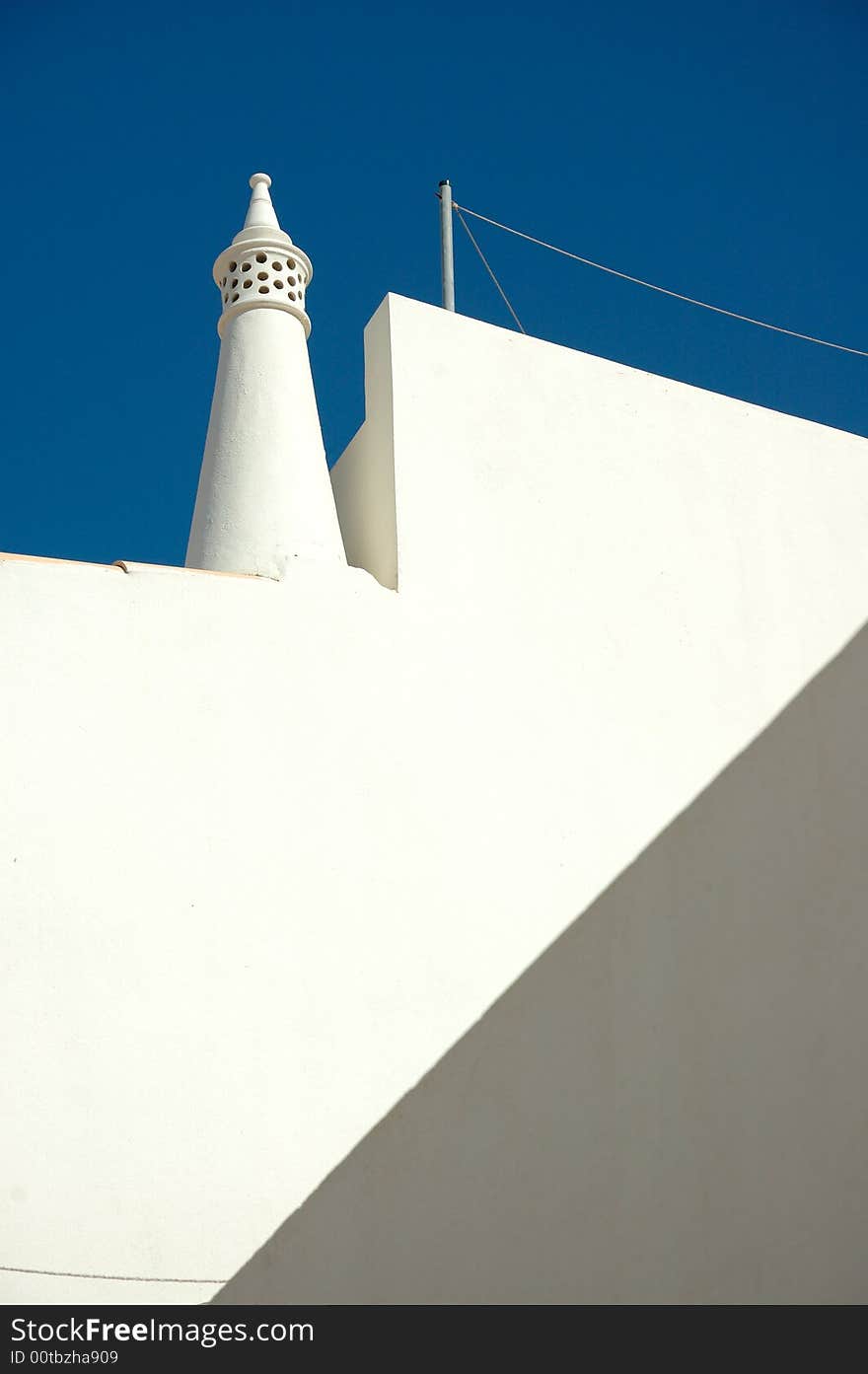 White wall and deep blue sky