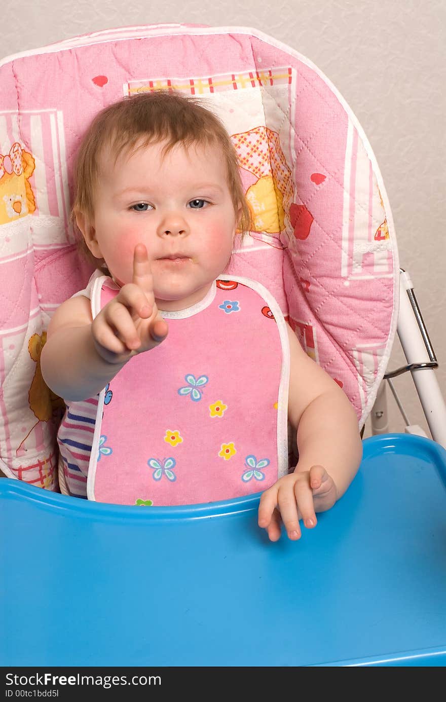 Portrait of the beautiful little girl behind a table. Portrait of the beautiful little girl behind a table