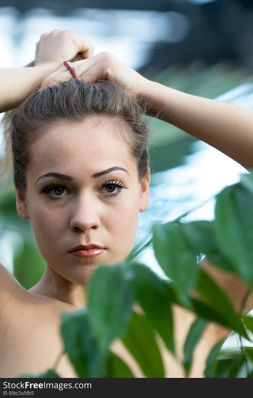 Portrait of the young beautiful woman on a green background. Portrait of the young beautiful woman on a green background