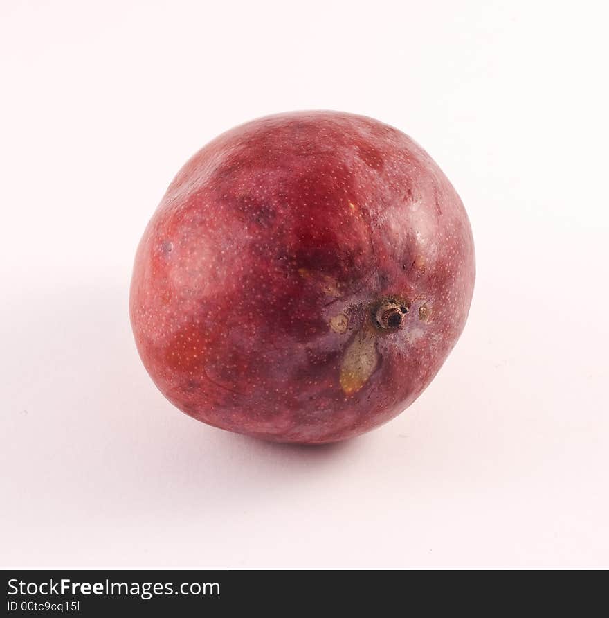 Mango on a white background. Mango is a low-calorie fruit that is high in fibre, and is a great source of vitamins A and C. It also contains folate, B6, iron and a little calcium, zinc and vitamin E.A mango is a juicy stone fruit produced from numerous species of tropical trees belonging to the flowering plant genus Mangifera, cultivated mostly for their edible fruit. Most of these species are found in nature as wild mangoes. The genus belongs to the cashew family Anacardiaceae.  Taste. The ripe flesh of the mango is soft and juicy, pale orange in colour, and has a texture ranging from fibrous to almost the consistency of butter. The flesh tastes fresh and sweet and emits a sweet fragrance.