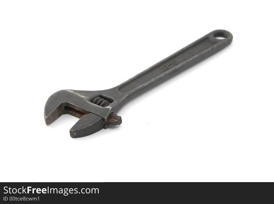 Iron adjustable spanner on a white background