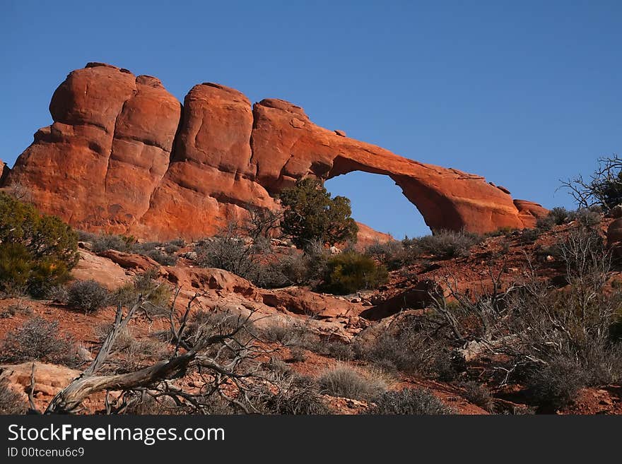 View of the red rock formations in Arches National Park with blue sky�s and clouds. View of the red rock formations in Arches National Park with blue sky�s and clouds