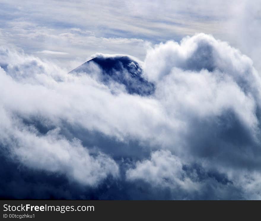 Mount Fuji enshrouded in clouds. Mount Fuji enshrouded in clouds